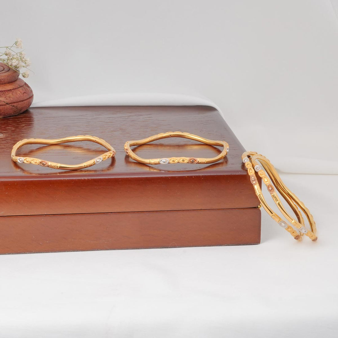Shine Twist Gold Bangles